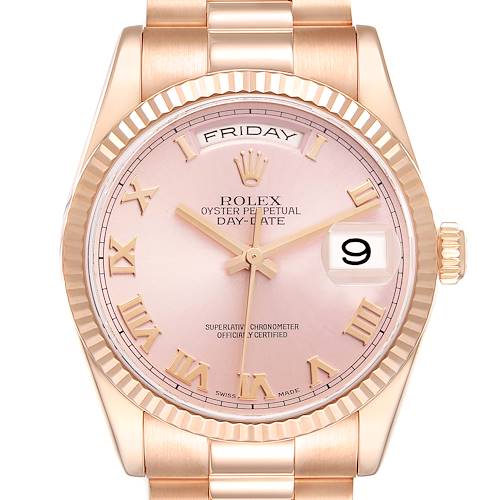 The Rolex President 118235 Men's Rose Gold Pink Dial 118235 Men's Rose Gold Pink Dial watch is shown from the front, featuring a pink dial, day-date display, and Roman numerals.