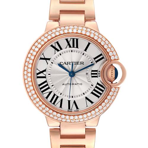 The Cartier Ballon Bleu WE902064 Men's Rose Gold Silver Dial WE902064 Men's Rose Gold Silver Dial watch is shown from the front, displaying the face, Roman numerals, diamond bezel, and part of the bracelet.