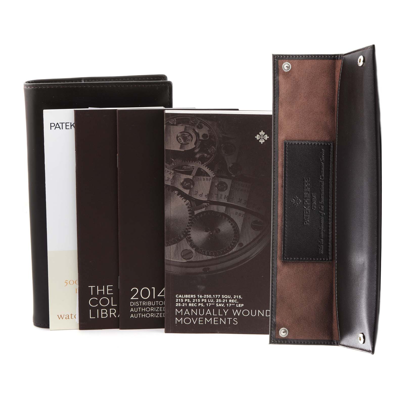 The image shows booklets and a watch pouch for the Patek Philippe Calatrava 5116R Men's Rose Gold White Dial 5116R Men's Rose Gold White Dial model, highlighting manuals and a leather case.