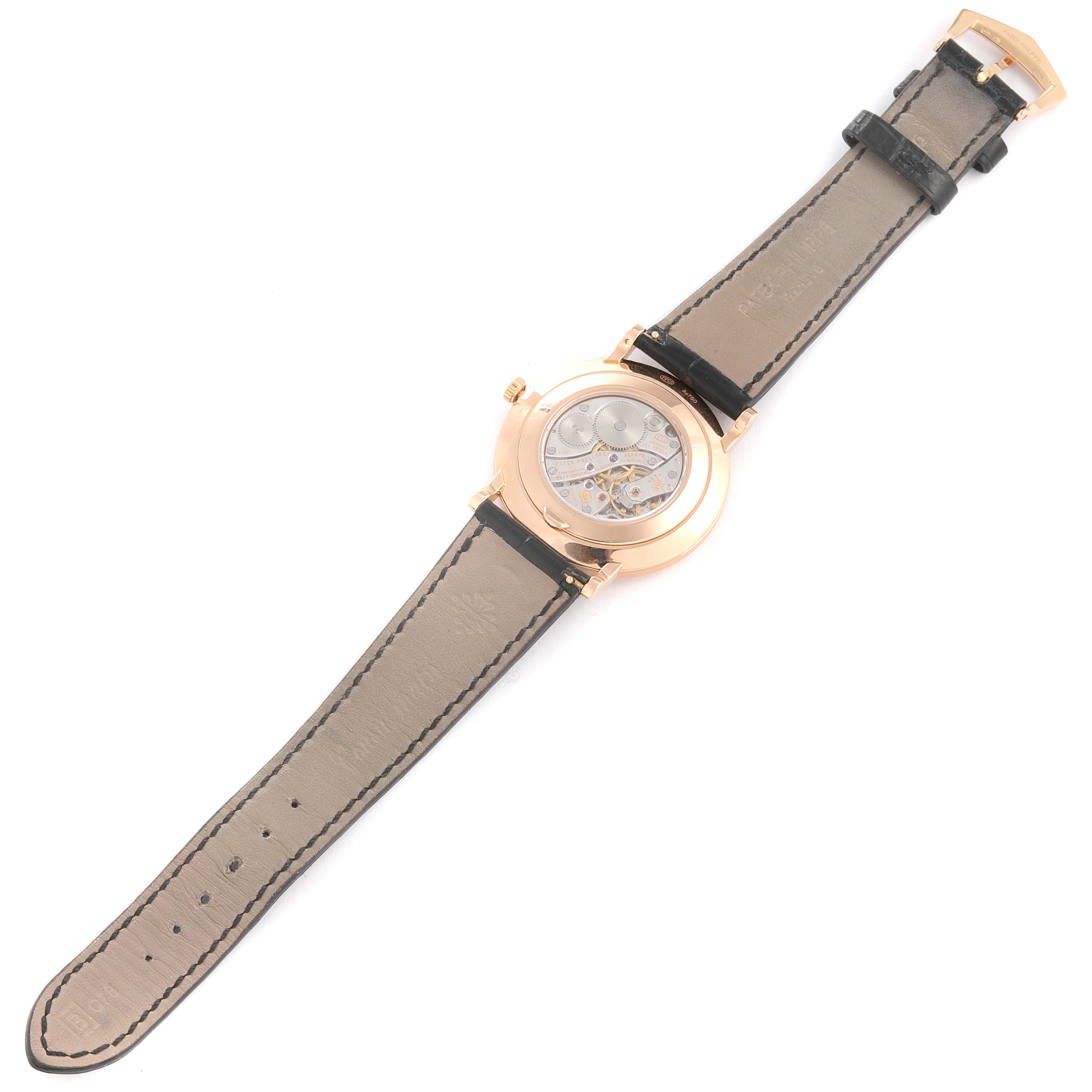 The image shows the back and strap of a Patek Philippe Calatrava 5116R Men's Rose Gold White Dial 5116R Men's Rose Gold White Dial watch, highlighting the movement through a transparent case back.