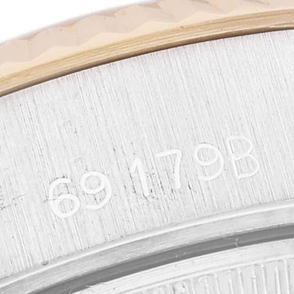 This close-up shows the serial number on the case back of a Rolex President 69179G Women's White Gold Champagne Dial 69179G Women's White Gold Champagne Dial model watch.