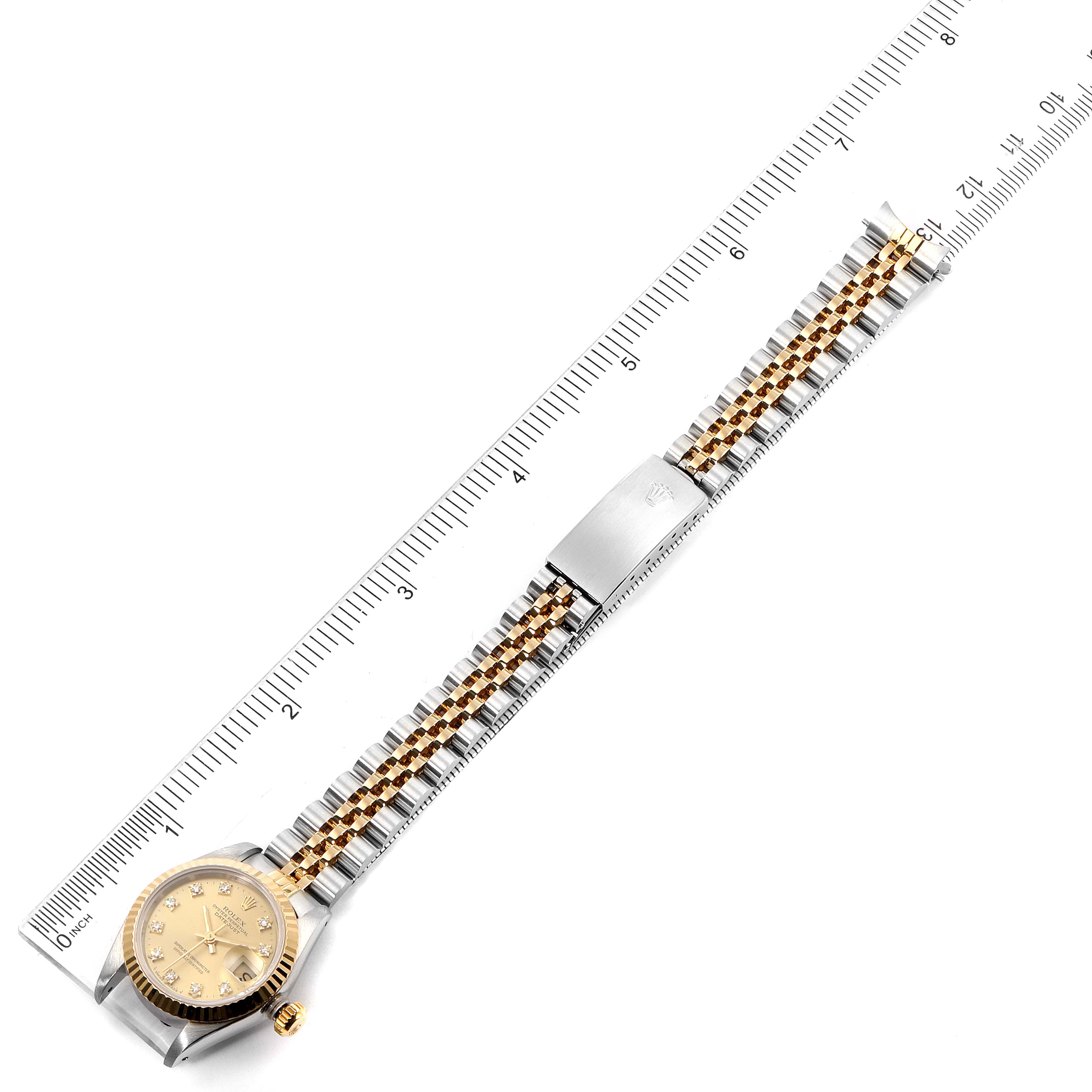 The Rolex Datejust 69173 Women's Steel and Gold (two tone) Champagne Dial 69173 Women's Steel and Gold (two tone) Champagne Dial watch is shown fully extended, lying flat with the dial, bezel, bracelet, and clasp in view.