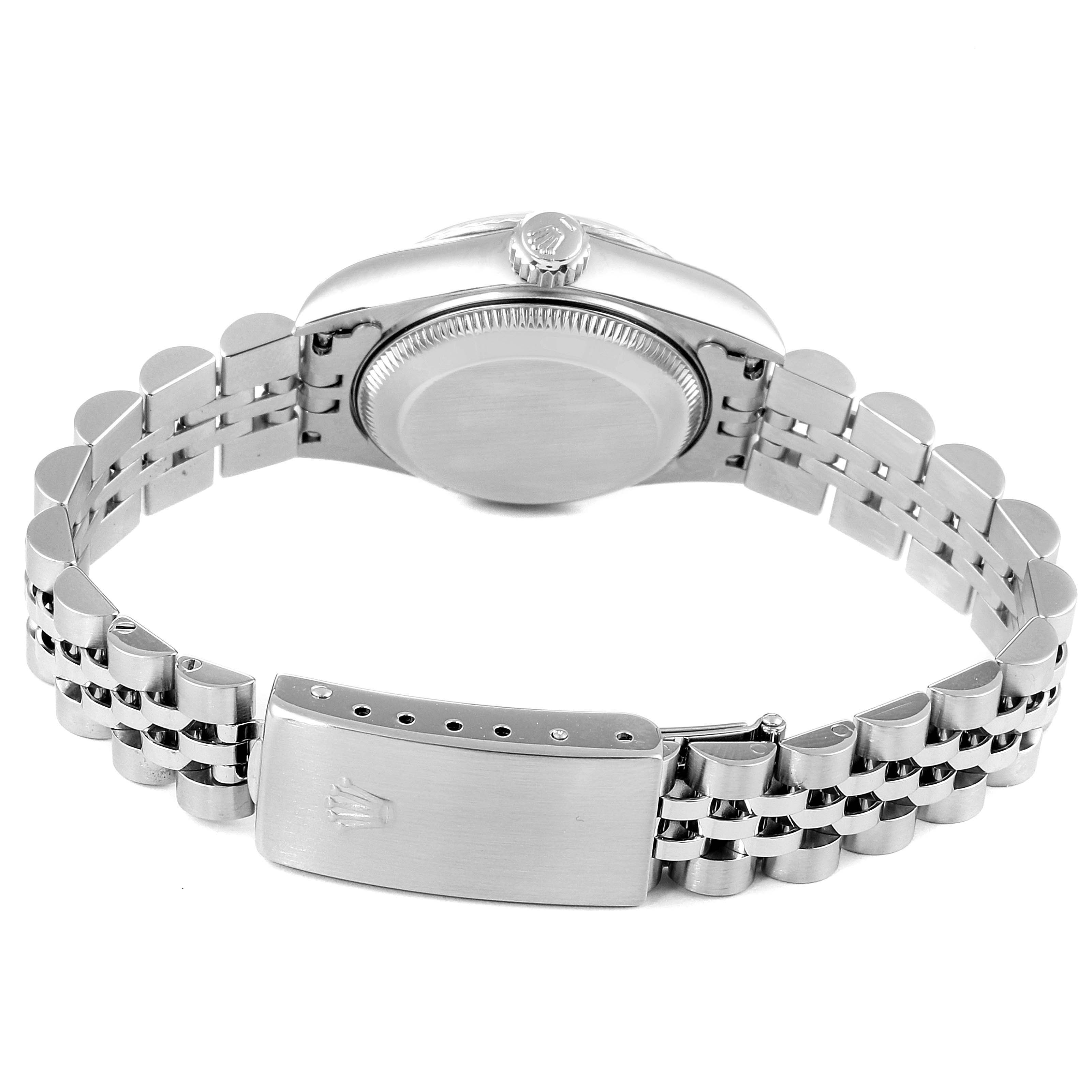 The image shows the back of a Rolex Datejust 69174 Women's Stainless Steel Silver Dial 69174 Women's Stainless Steel Silver Dial watch, focusing on the case back and the opened bracelet with the clasp.