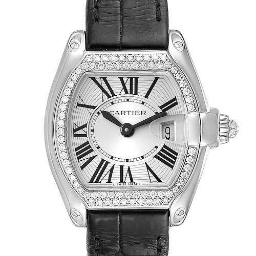 The image shows a close-up view of the Cartier Roadster WE500260 Women's White Gold Silver Dial WE500260 Women's White Gold Silver Dial watch, highlighting its face, bezel, and leather strap.
