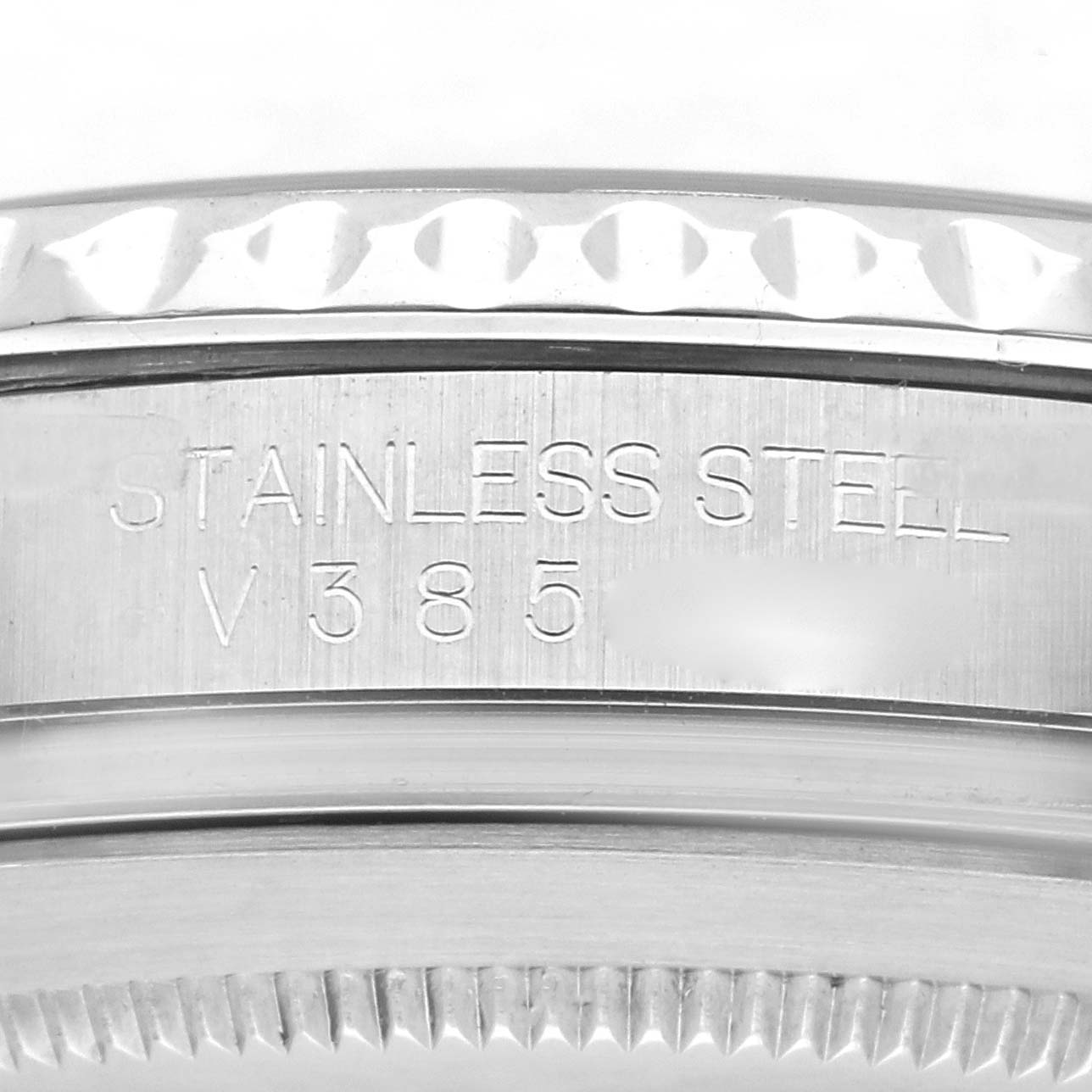 The image shows a close-up of the bezel and engraved edge of a Rolex Yacht-Master 16622 Men's Stainless Steel Silver Dial 16622 Men's Stainless Steel Silver Dial watch, highlighting its stainless steel construction.