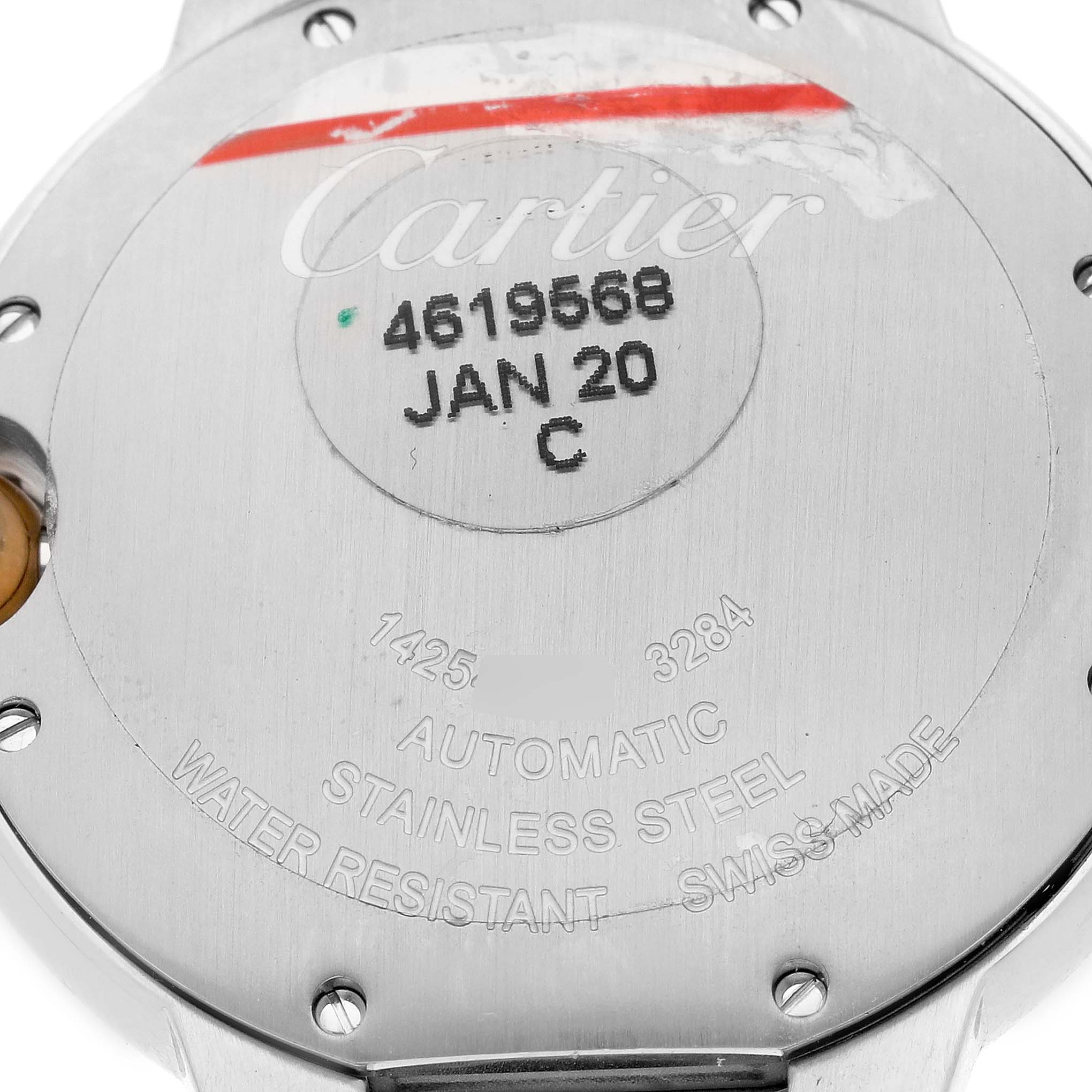 The image shows the case back of a Cartier Ballon Bleu W2BB0012 Women's Steel and Gold (two tone) Silver Dial W2BB0012 Women's Steel and Gold (two tone) Silver Dial watch, displaying engravings and a serial number.