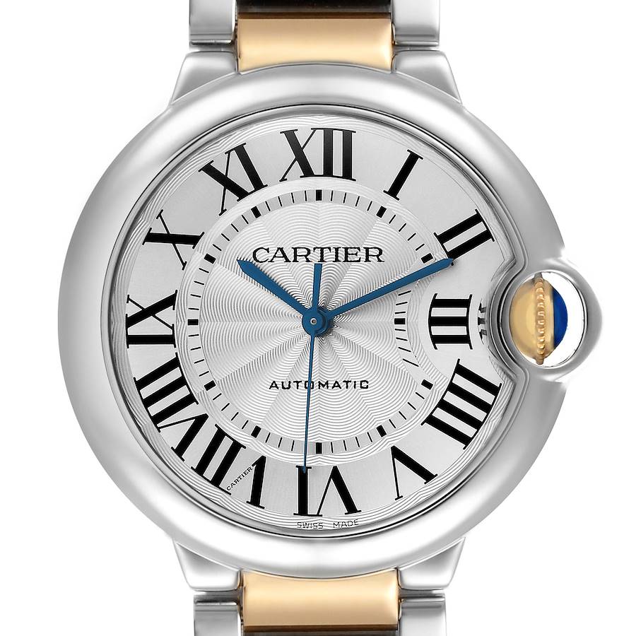 The Cartier Ballon Bleu W2BB0012 Women's Steel and Gold (two tone) Silver Dial W2BB0012 Women's Steel and Gold (two tone) Silver Dial watch is shown from a front angle, highlighting the face and crown with its signature blue sapphire.