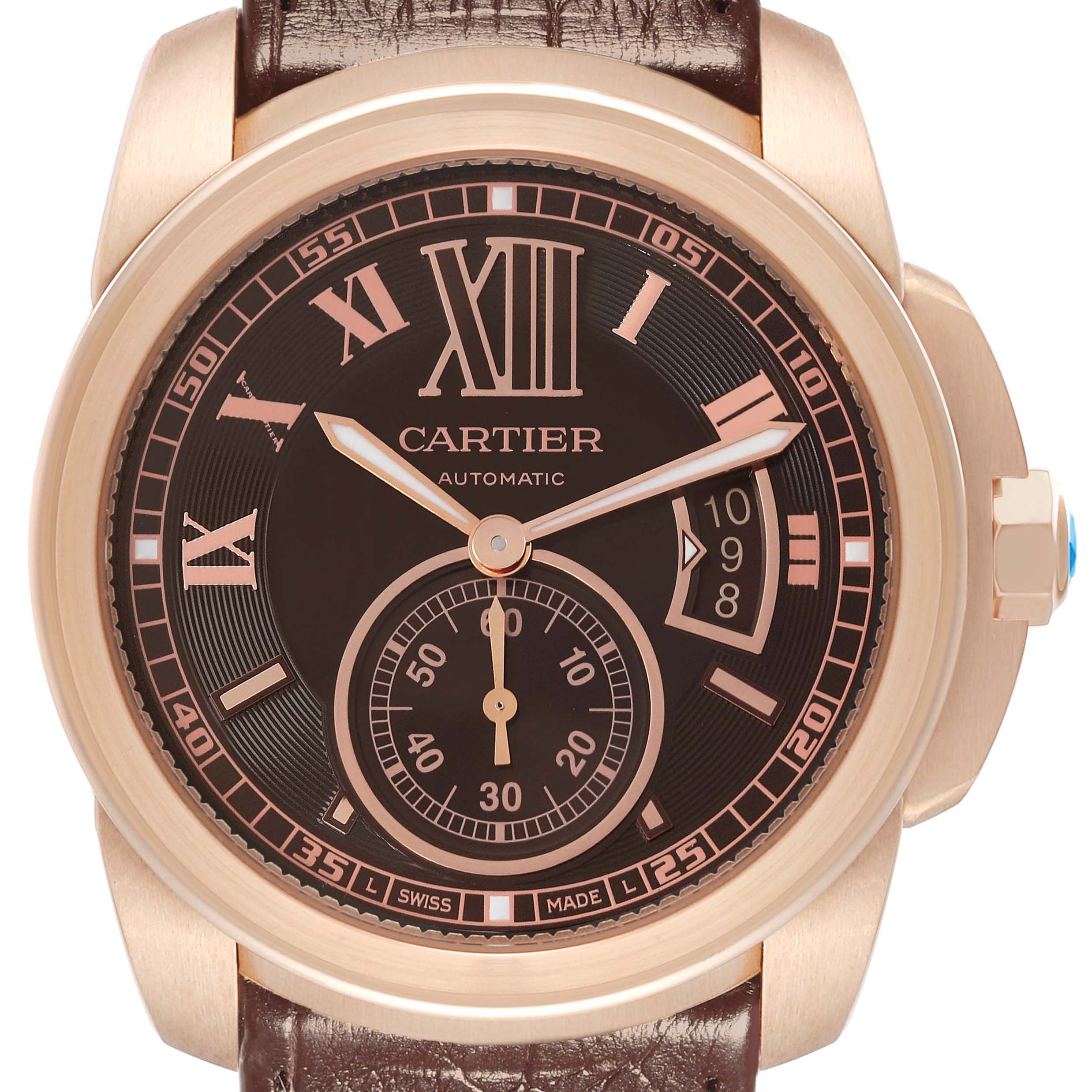 The Calibre de Cartier model W7100007 watch is shown from the front, highlighting its dial, numerals, hands, subdial, date window, crown, and leather strap.
