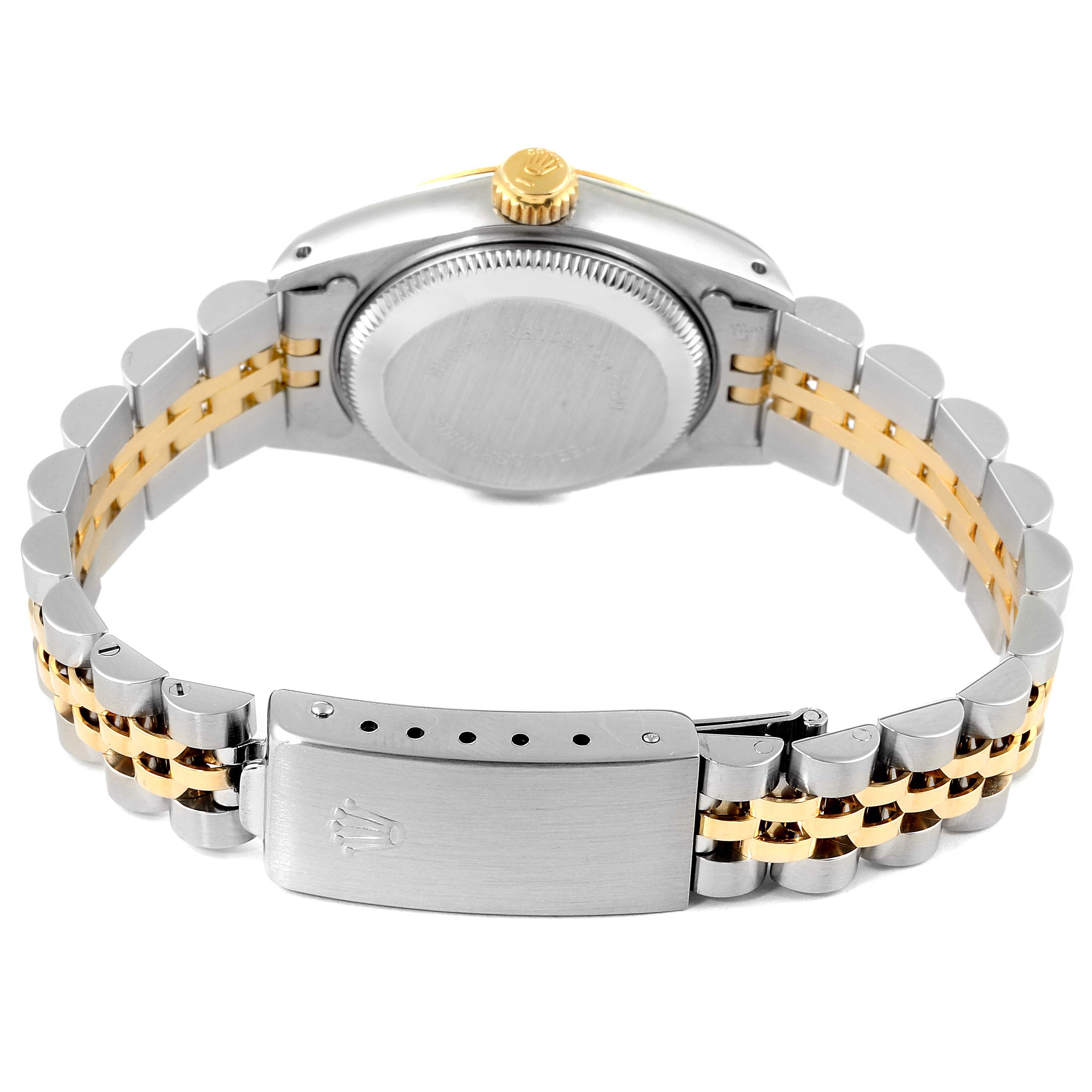 The image shows the back view of a Rolex Datejust 69173 Women's Steel and Gold (two tone) Champagne Dial 69173 Women's Steel and Gold (two tone) Champagne Dial watch, highlighting the case, crown, and two-tone bracelet with a clasp.