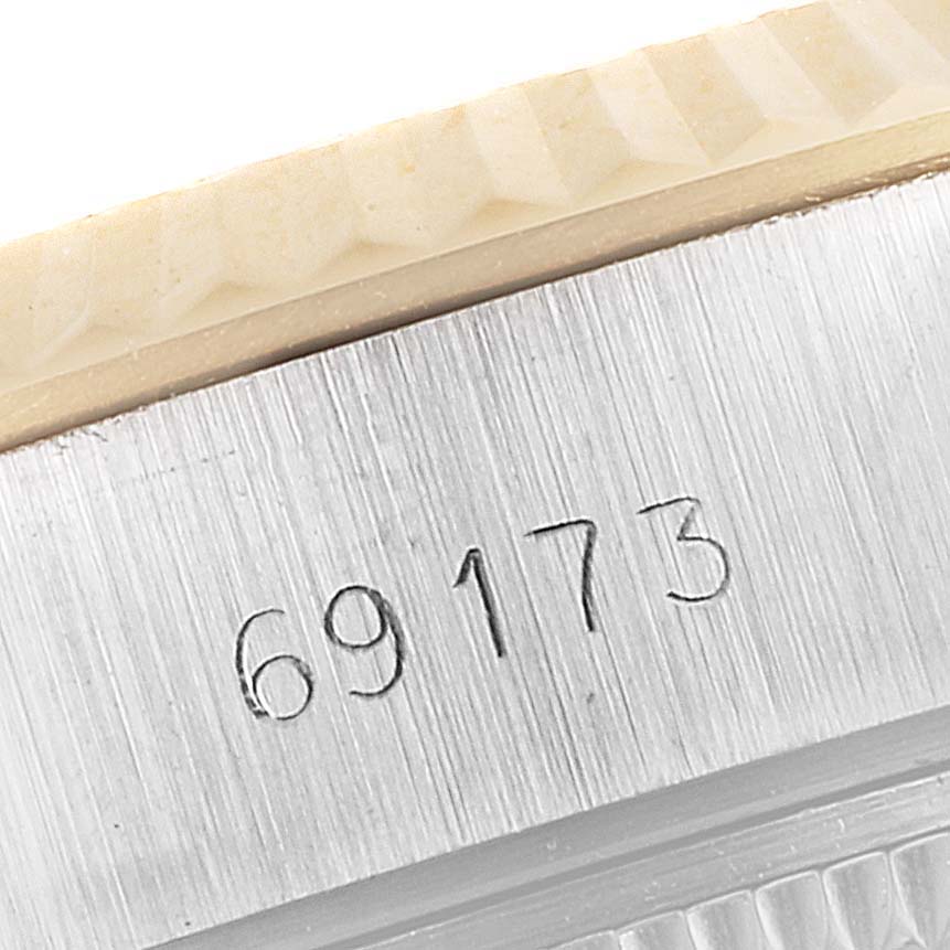 This close-up shows the model number "69173" engraved on the case of a Rolex Datejust 69173 Women's Steel and Gold (two tone) Champagne Dial 69173 Women's Steel and Gold (two tone) Champagne Dial watch.