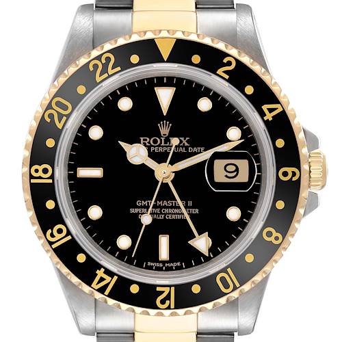 The Rolex GMT-Master 16713 Men's Steel and Gold (two tone) Black Dial 16713 Men's Steel and Gold (two tone) Black Dial watch is shown from the front, displaying the dial, hands, bezel, and part of the bracelet.