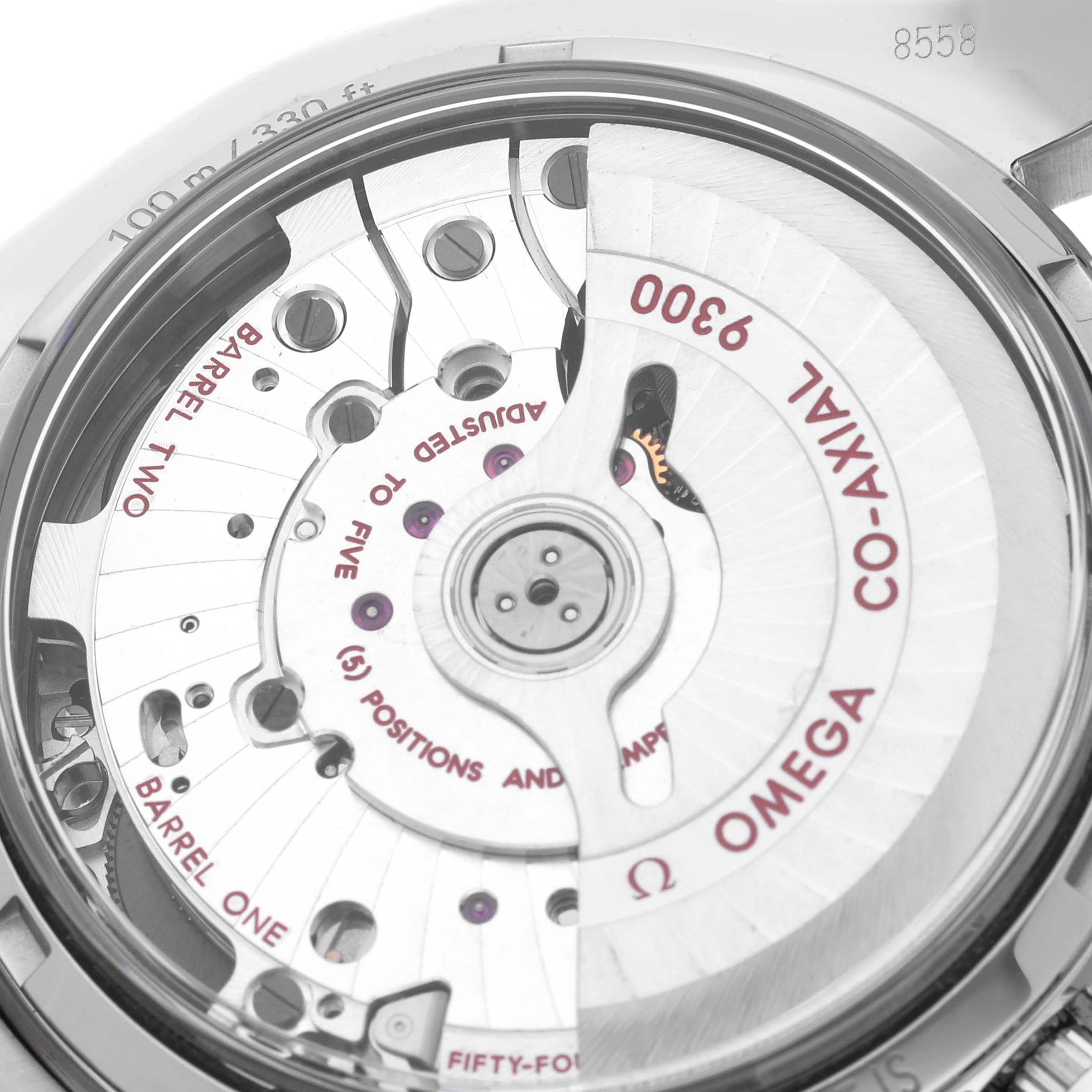 The image shows the movement of an Omega Seamaster 311.30.44.51.01.002 Men's Stainless Steel Black Dial 311.30.44.51.01.002 Men's Stainless Steel Black Dial, highlighting the co-axial mechanism and detailed engravings.