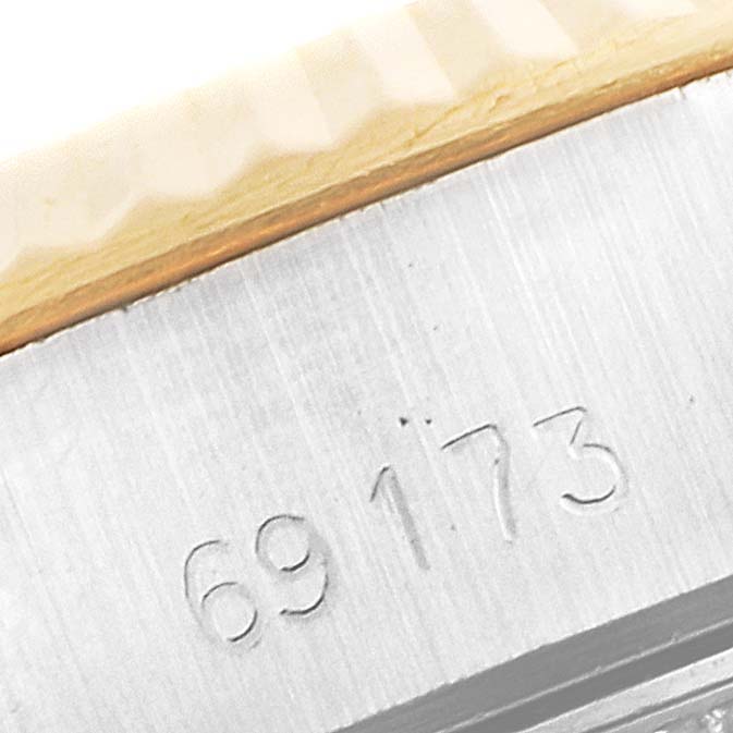 This image shows a close-up of the case with the model number of the Rolex Datejust 69173 Women's Steel and Gold (two tone) Champagne Dial 69173 Women's Steel and Gold (two tone) Champagne Dial watch.