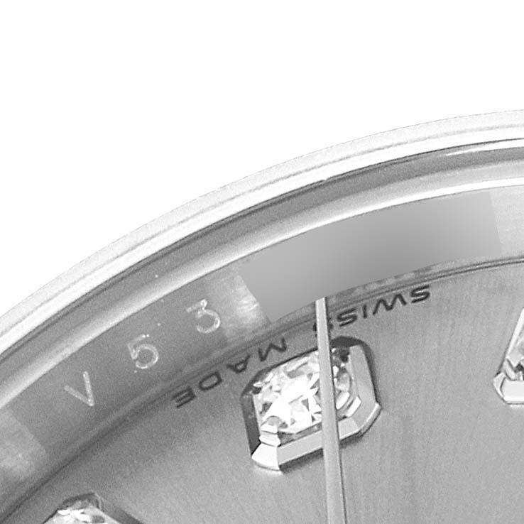 This close-up of a Rolex Datejust 179174 Women's Stainless Steel Silver Dial 179174 Women's Stainless Steel Silver Dial watch shows part of the dial, indices with diamonds, and the "Swiss Made" text near the bottom.