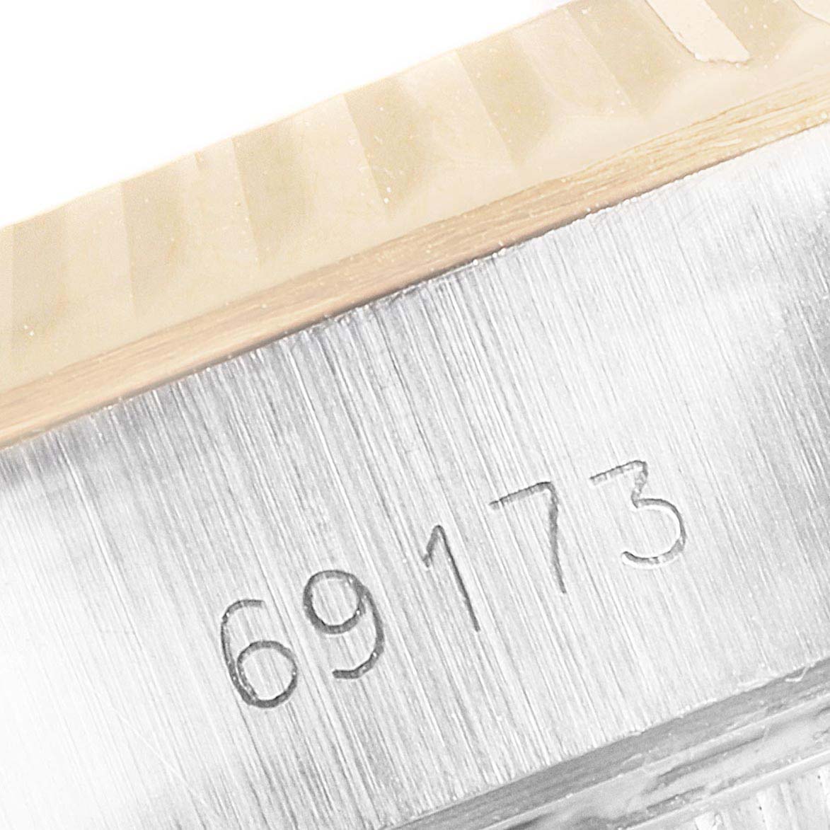 This is a close-up of the case and serial number (69173) from a Rolex Datejust 69173 Women's Steel and Gold (two tone) Champagne Dial 69173 Women's Steel and Gold (two tone) Champagne Dial model watch.