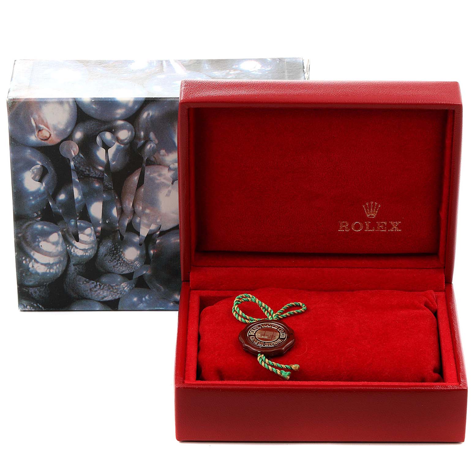 This Datejust model Rolex packaging includes an open red case with the Rolex logo and a certification tag, alongside its outer box.
