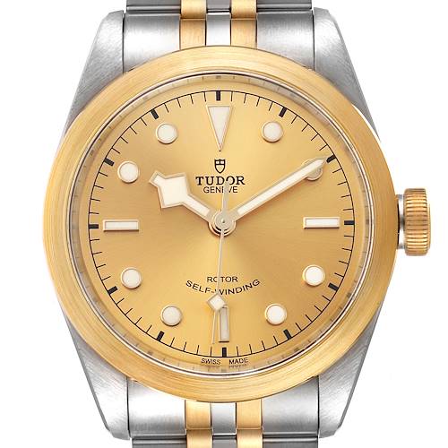 The image shows a front view of the Tudor Heritage Black Bay 79543 Men's Steel and Gold (two tone) Champagne Dial 79543 Men's Steel and Gold (two tone) Champagne Dial watch, highlighting its gold dial, bezel, and two-tone bracelet.