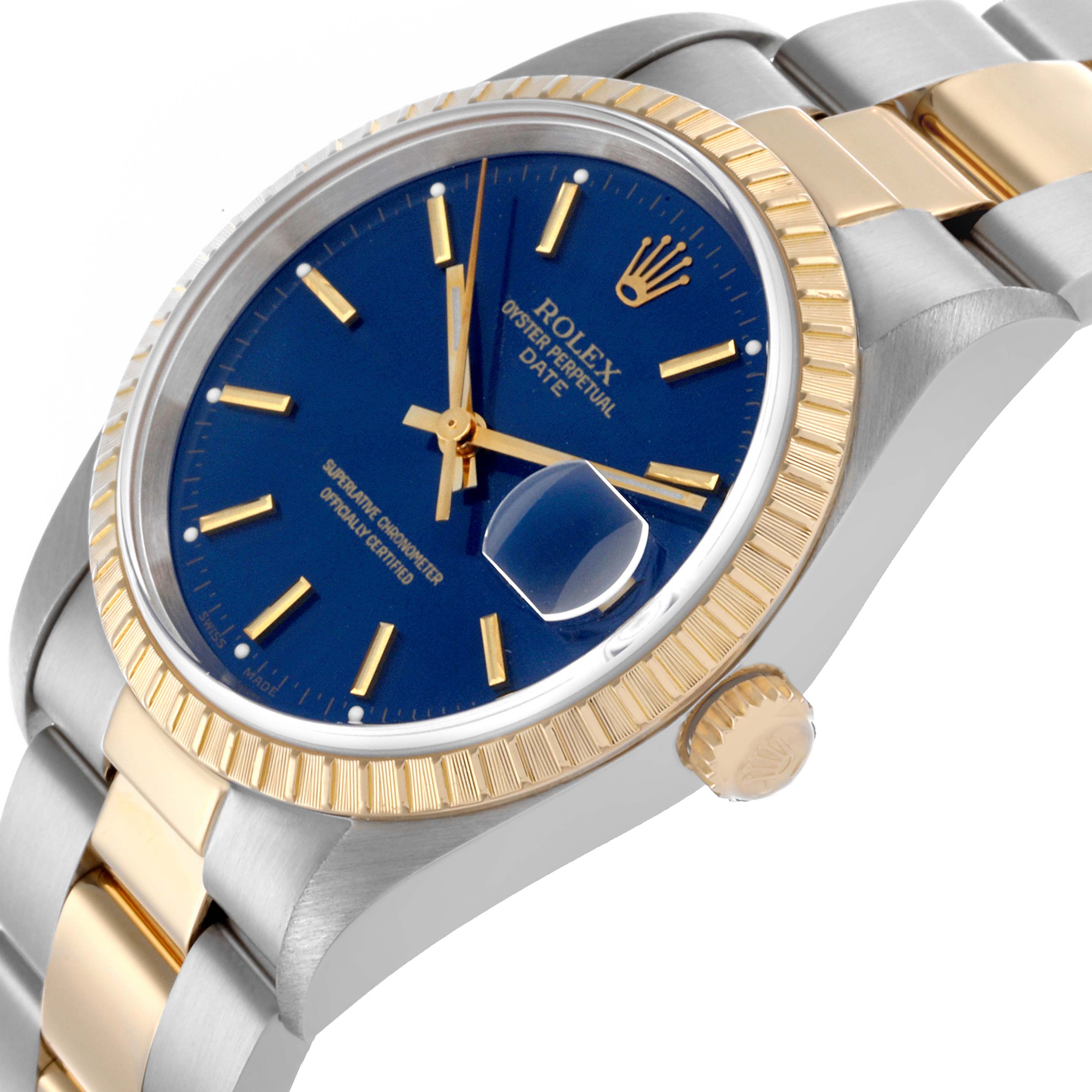 The Rolex Date 15223 Men's Steel and Gold (two tone) Blue Dial 15223 Men's Steel and Gold (two tone) Blue Dial watch is shown at an angled side view, highlighting the bezel, crown, and part of the bracelet.