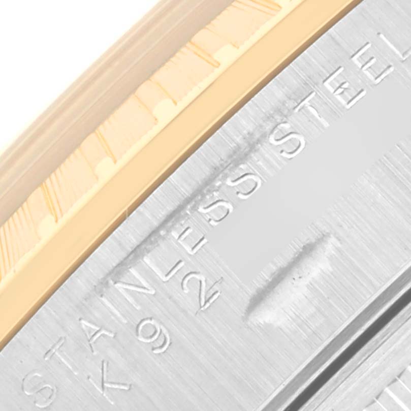 The image shows a close-up of the side of a Rolex Date 15223 Men's Steel and Gold (two tone) Blue Dial 15223 Men's Steel and Gold (two tone) Blue Dial model, highlighting the stainless steel material.