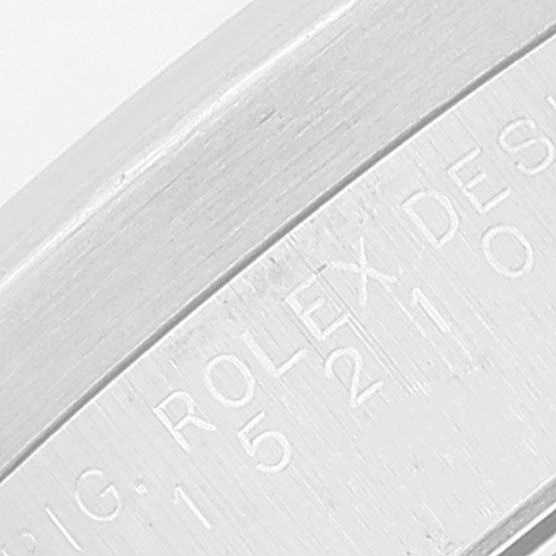 This image shows a close-up of the engraved casing side of a Rolex Air-King watch.