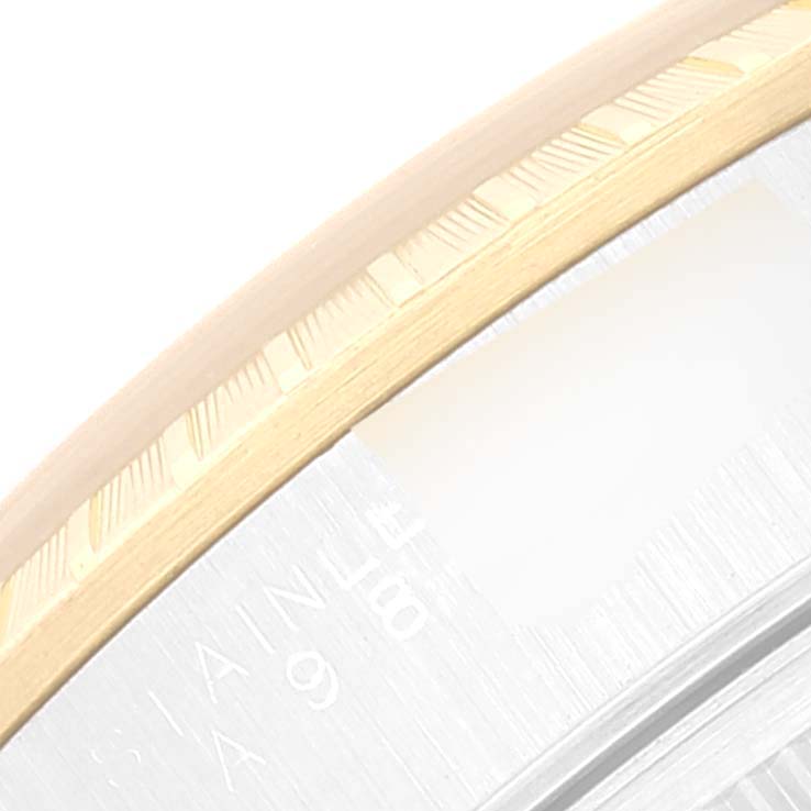 This close-up image shows the fluted bezel detail of a Rolex Date 15223 Men's Steel and Gold (two tone) Champagne Dial 15223 Men's Steel and Gold (two tone) Champagne Dial watch.