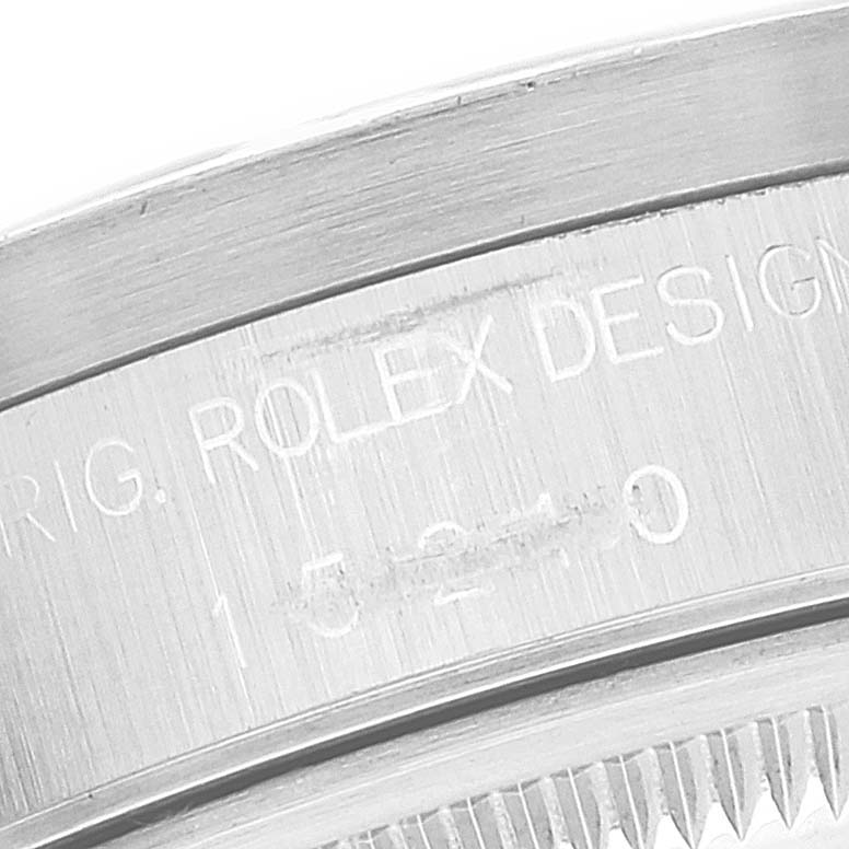 This image shows a close-up of the casing and engraved serial number of a Rolex Date 15210 Men's Stainless Steel White Dial 15210 Men's Stainless Steel White Dial model watch.
