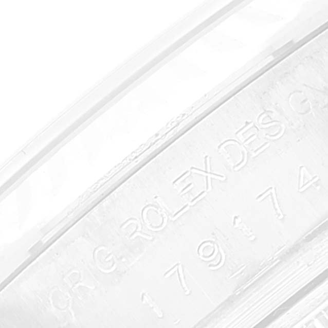 This image shows an engraved section of the inner bezel of a Rolex Datejust 179174 Women's Stainless Steel Black Dial 179174 Women's Stainless Steel Black Dial watch, featuring the model and brand name.