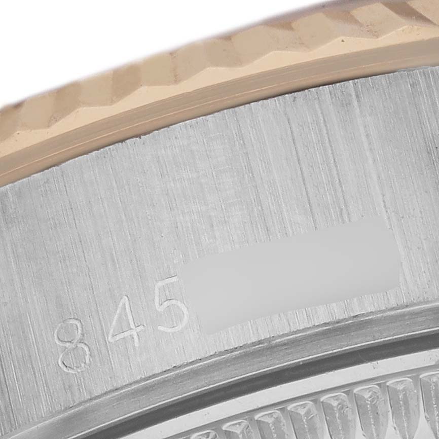 The image shows a close-up of the bezel and case edge of a Rolex Date 69173 Women's Steel and Gold (two tone) White Dial 69173 Women's Steel and Gold (two tone) White Dial watch.