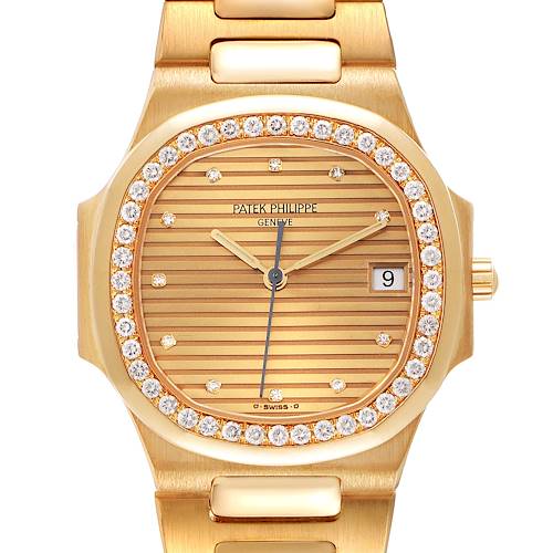 The image shows a front view of a Patek Philippe Nautilus 3900/003 Women's Yellow Gold Champagne Dial 3900/003 Women's Yellow Gold Champagne Dial watch with a gold bracelet and diamond bezel.