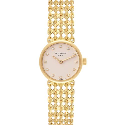 This Patek Philippe Vintage 4647/001 Women's Yellow Gold Beige Dial 4647/001 Women's Yellow Gold Beige Dial watch is shown from a front angle, displaying its round dial and intricate chain bracelet.