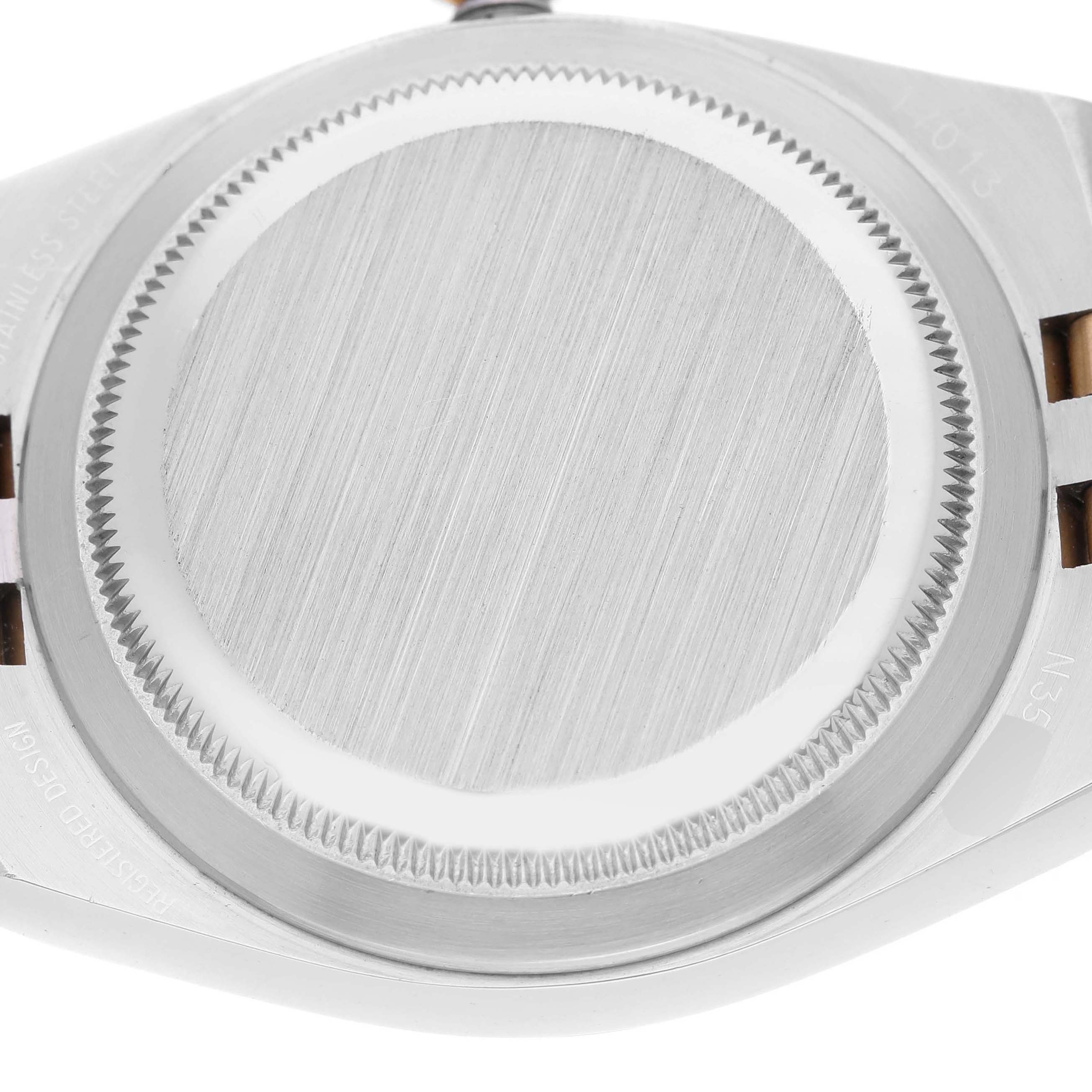 Up-close view of the back case of the Rolex Oysterquartz 17013 Men's Steel and Gold (two tone) Champagne Dial 17013 Men's Steel and Gold (two tone) Champagne Dial model, showing the brushed finish and screws.