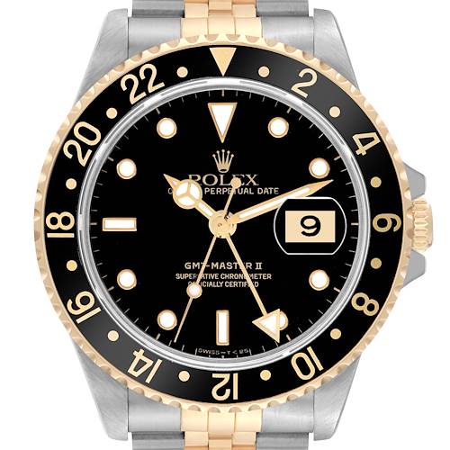 The image shows a Rolex GMT-Master 16713 Men's Steel and Gold (two tone) Black Dial 16713 Men's Steel and Gold (two tone) Black Dial II watch from a front view, highlighting its black and gold bezel, dial, and date feature.