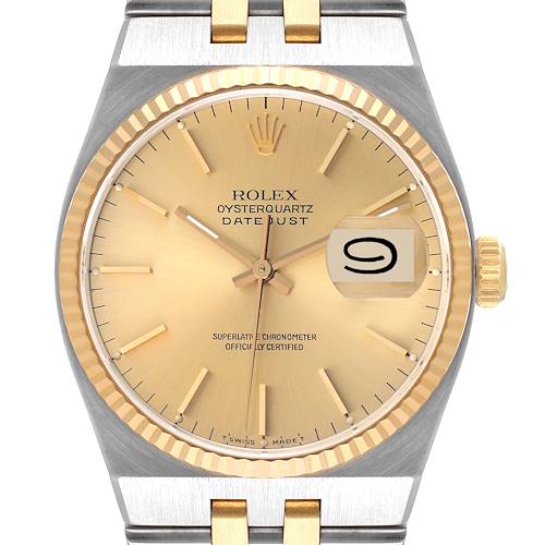 Front view of the Rolex Oysterquartz 17013 Men's Steel and Gold (two tone) Champagne Dial 17013 Men's Steel and Gold (two tone) Champagne Dial Datejust watch, showing the dial, date window, bezel, and part of the bracelet.