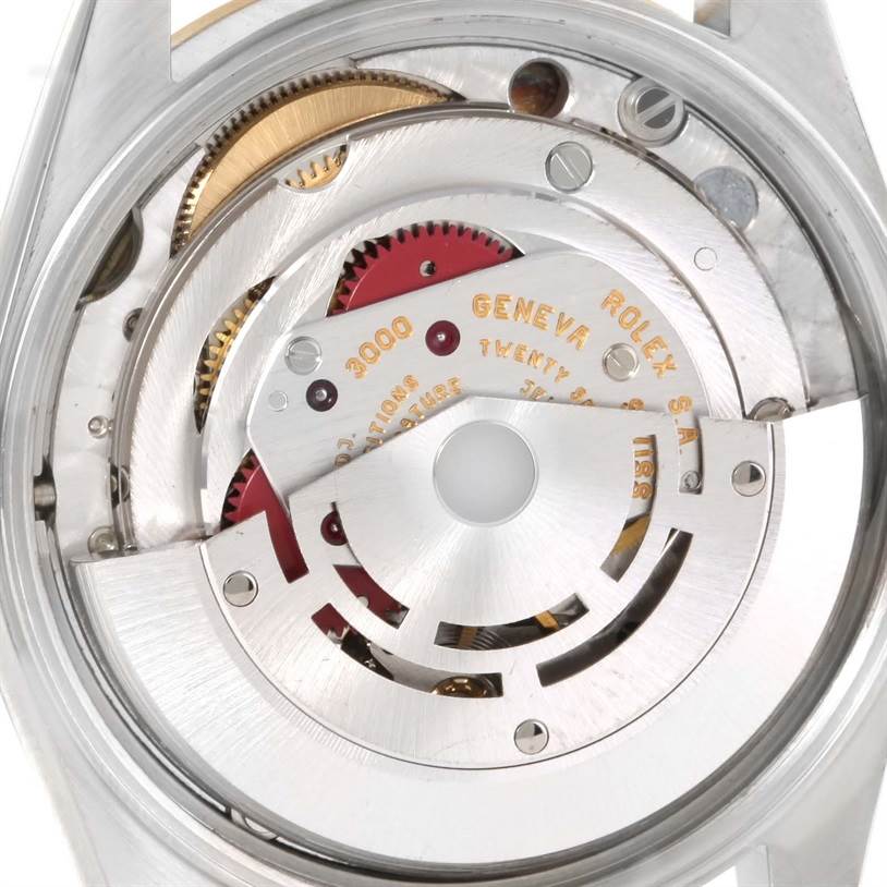 This is an image showing the inner mechanism or movement of a Rolex Oyster Perpetual 14203 Men's Steel and Gold (two tone) Champagne Dial 14203 Men's Steel and Gold (two tone) Champagne Dial watch.