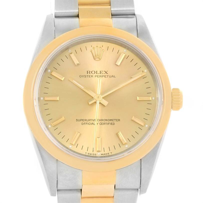 The Rolex Oyster Perpetual 14203 Men's Steel and Gold (two tone) Champagne Dial 14203 Men's Steel and Gold (two tone) Champagne Dial watch is shown from a front angle, displaying its dial, bezel, and part of the bracelet.