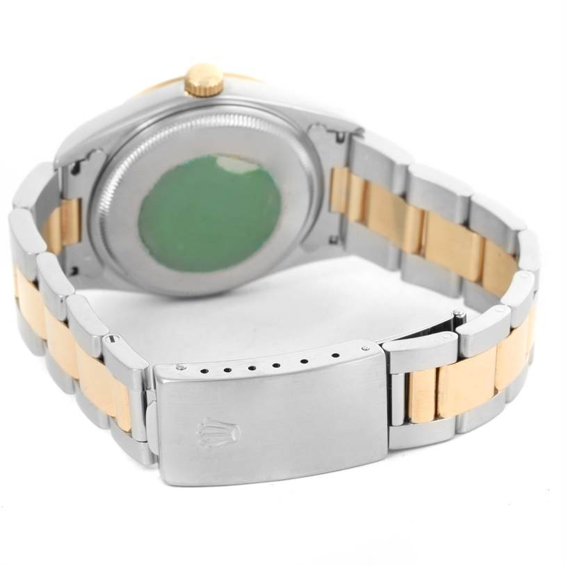 The image shows the back view of the Rolex Oyster Perpetual 14203 Men's Steel and Gold (two tone) Champagne Dial 14203 Men's Steel and Gold (two tone) Champagne Dial watch, displaying the bracelet and clasp.