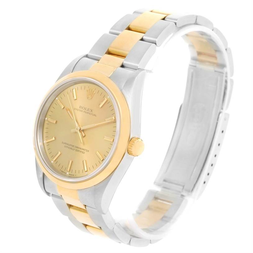 The image shows a Rolex Oyster Perpetual 14203 Men's Steel and Gold (two tone) Champagne Dial 14203 Men's Steel and Gold (two tone) Champagne Dial watch at a three-quarter angle, highlighting its gold and silver bracelet and dial.