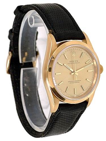 The image shows a side view of a Rolex Oyster Perpetual 14208 Men's Yellow Gold Champagne Dial 14208 Men's Yellow Gold Champagne Dial watch, displaying the face, bezel, and black leather strap.