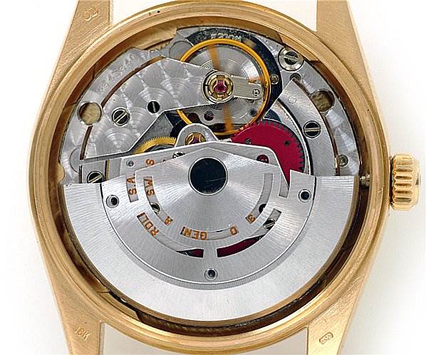 This image shows the inner mechanical parts of the Rolex Oyster Perpetual 14208 Men's Yellow Gold Champagne Dial 14208 Men's Yellow Gold Champagne Dial watch from a back view.