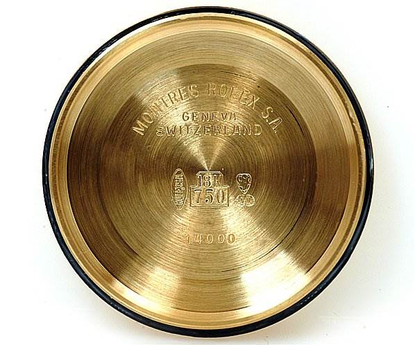 This image shows the inside case back of a Rolex Oyster Perpetual 14208 Men's Yellow Gold Champagne Dial 14208 Men's Yellow Gold Champagne Dial watch, featuring engravings of model details and manufacturing marks.