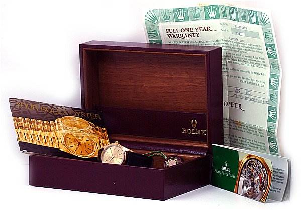 The image shows a Rolex Oyster Perpetual 14208 Men's Yellow Gold Champagne Dial 14208 Men's Yellow Gold Champagne Dial watch with its box, warranty card, and informational booklets.