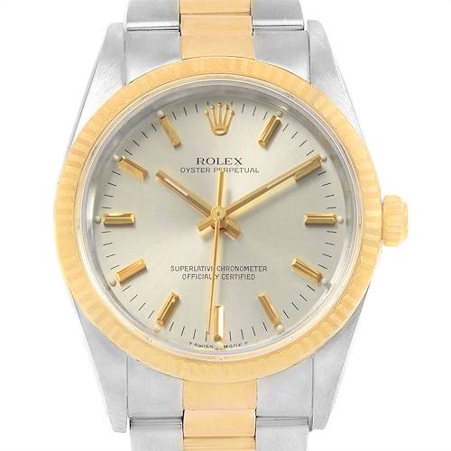 The image shows a Rolex Oyster Perpetual 14233 Men's Steel and Gold (two tone) Silver Dial 14233 Men's Steel and Gold (two tone) Silver Dial watch from a front angle, highlighting the dial, bezel, and part of the bracelet.