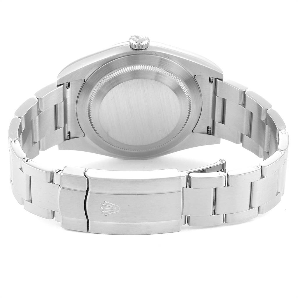 The image shows the backside of a Rolex Oyster Perpetual 114300 Men's Stainless Steel Burgundy Dial 114300 Men's Stainless Steel Burgundy Dial watch, highlighting the closed clasp and case back.