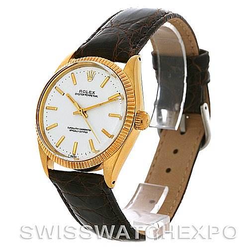 The Rolex Oyster Perpetual Men's Yellow Gold White Dial Men's Yellow Gold White Dial watch is shown at a three-quarter angle, displaying its face, case, and leather strap.