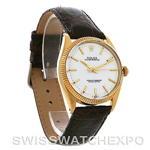The image shows a Rolex Oyster Perpetual Men's Yellow Gold White Dial Men's Yellow Gold White Dial watch with a leather strap, gold case, and white dial, viewed at a front diagonal angle.