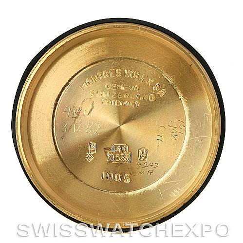 This image shows the inside case back of a Rolex Oyster Perpetual Men's Yellow Gold White Dial Men's Yellow Gold White Dial watch, highlighting various inscriptions and markings.