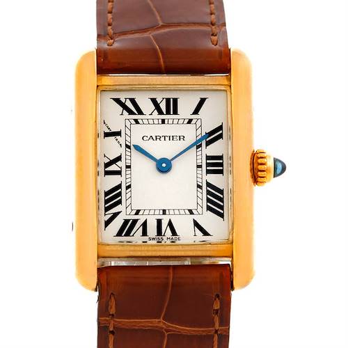 The image shows a frontal view of a Cartier Tank Louis W1529856 Women's Yellow Gold Silver Dial W1529856 Women's Yellow Gold Silver Dial watch with a gold case, Roman numerals, blue hands, and a brown leather strap.