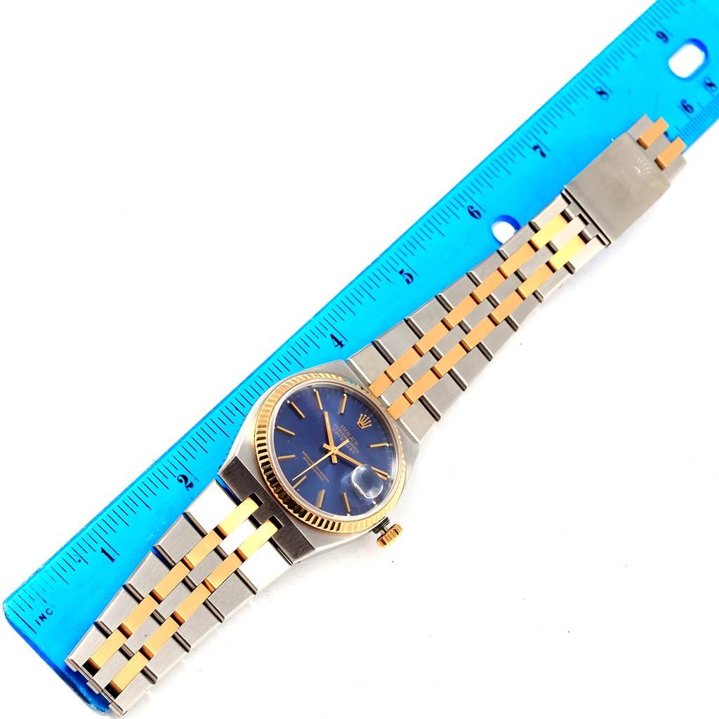 The Rolex Oysterquartz 17013 Men's Stainless Steel Blue Dial 17013 Men's Stainless Steel Blue Dial watch is shown from a top-down angle with its dial, case, and full bracelet visible.