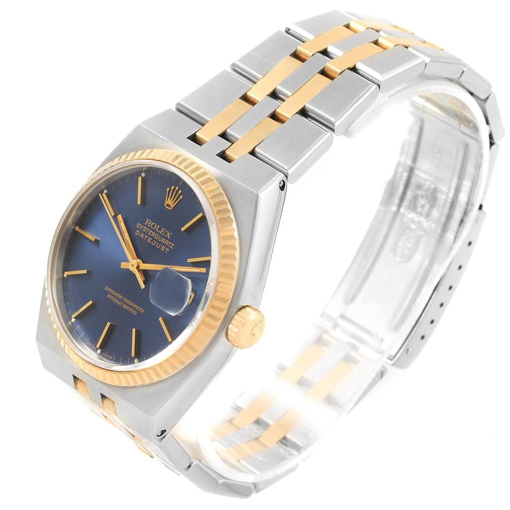 This image shows a Rolex Oysterquartz 17013 Men's Stainless Steel Blue Dial 17013 Men's Stainless Steel Blue Dial watch at a three-quarter angle, highlighting the blue dial, gold bezel, and two-tone metal bracelet.