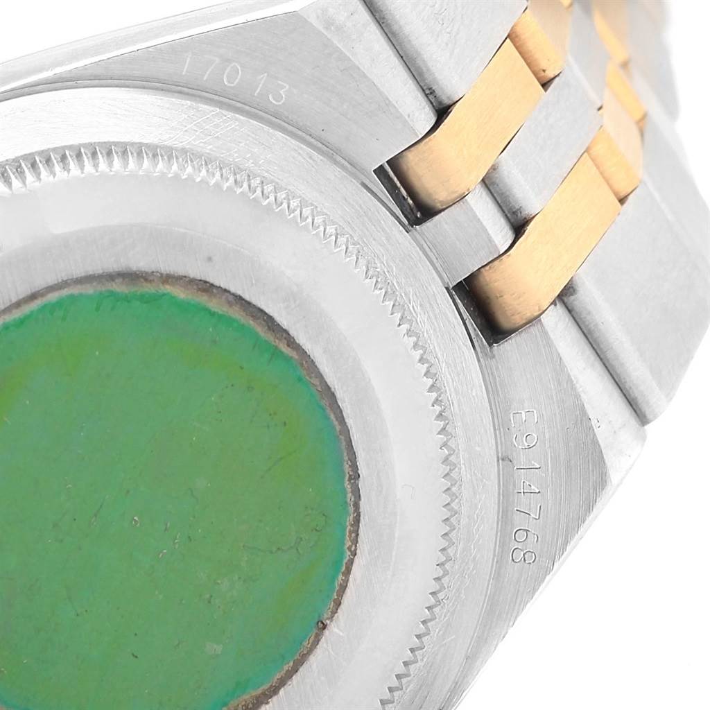 This image shows the back case and part of the metal bracelet of a Rolex Oysterquartz 17013 Men's Stainless Steel Blue Dial 17013 Men's Stainless Steel Blue Dial watch.